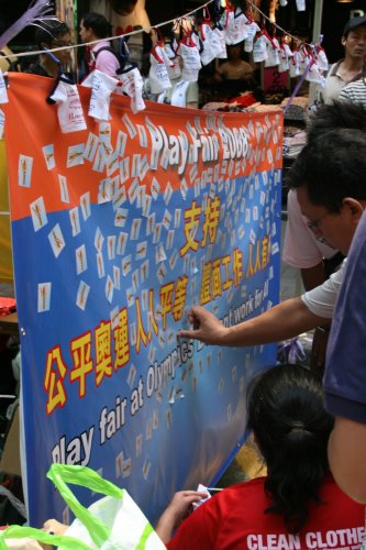 During an August 3rd street action in Mongkok, Play Fair activists invited pedestrians to show their support by putting a sticker on a PF banner.