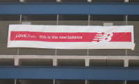 new balance parking lot with banner.jpg